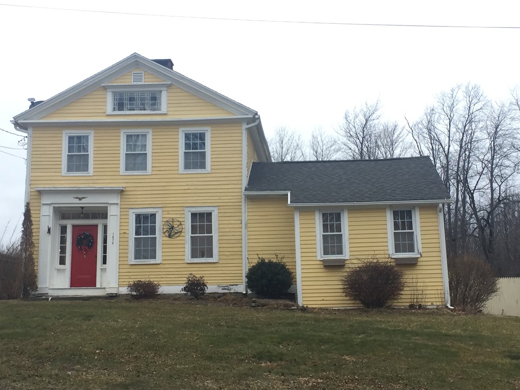 1572 Main Road Granville, MA 01034 - Photo 1 of 26 a front view of a house with a yard