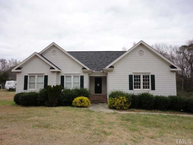 10020 Kennebec Road Willow Spring, NC 27592 - Photo 1 of 7 a view of a house with yard and plants