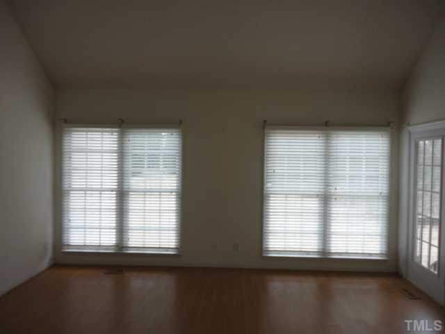 10020 Kennebec Road Willow Spring, NC 27592 - Photo 4 of 7 an empty room with a window