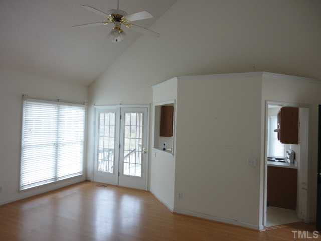 10020 Kennebec Road Willow Spring, NC 27592 - Photo 6 of 7 an empty room with windows and entrance