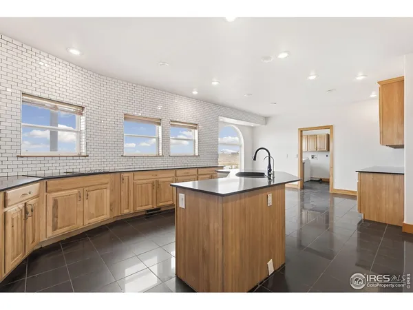 a kitchen with sink and cabinet