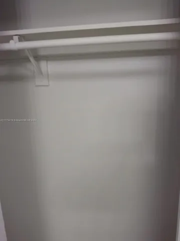 an empty room with a empty space and windows