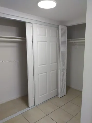 a view of a chandelier fan in a room