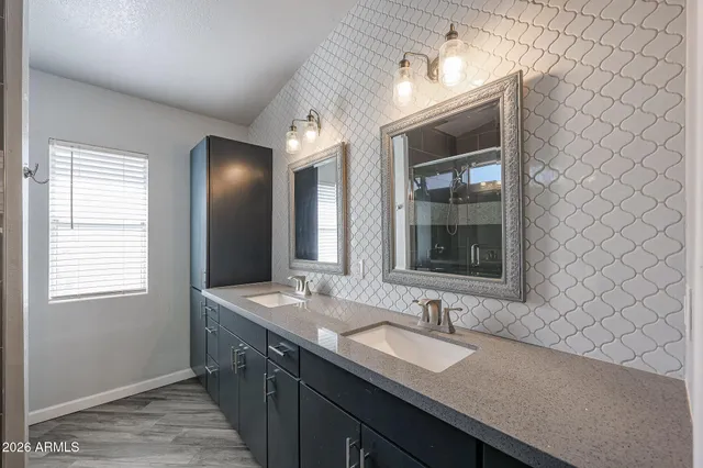 a bathroom with a glass shower door