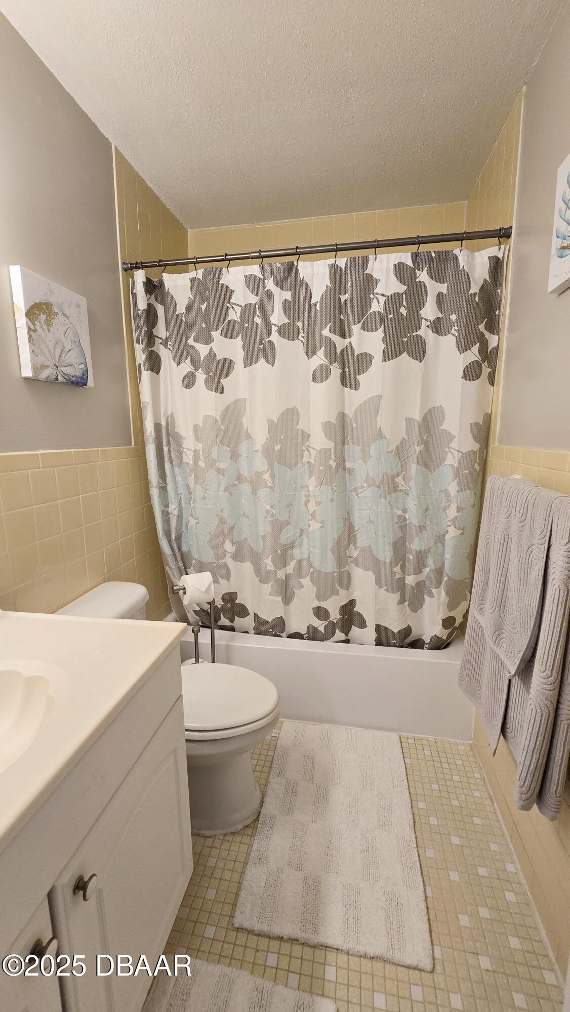 2750 Ocean Shore Boulevard, Unit 8 Ormond Beach, FL 32176 - Photo 12 of 60 a bathroom with a sink and a mirror