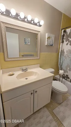 a bathroom with a sink a toilet and a bathtub