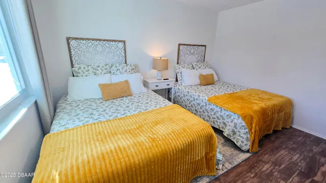 a room with a bed and a flat screen tv