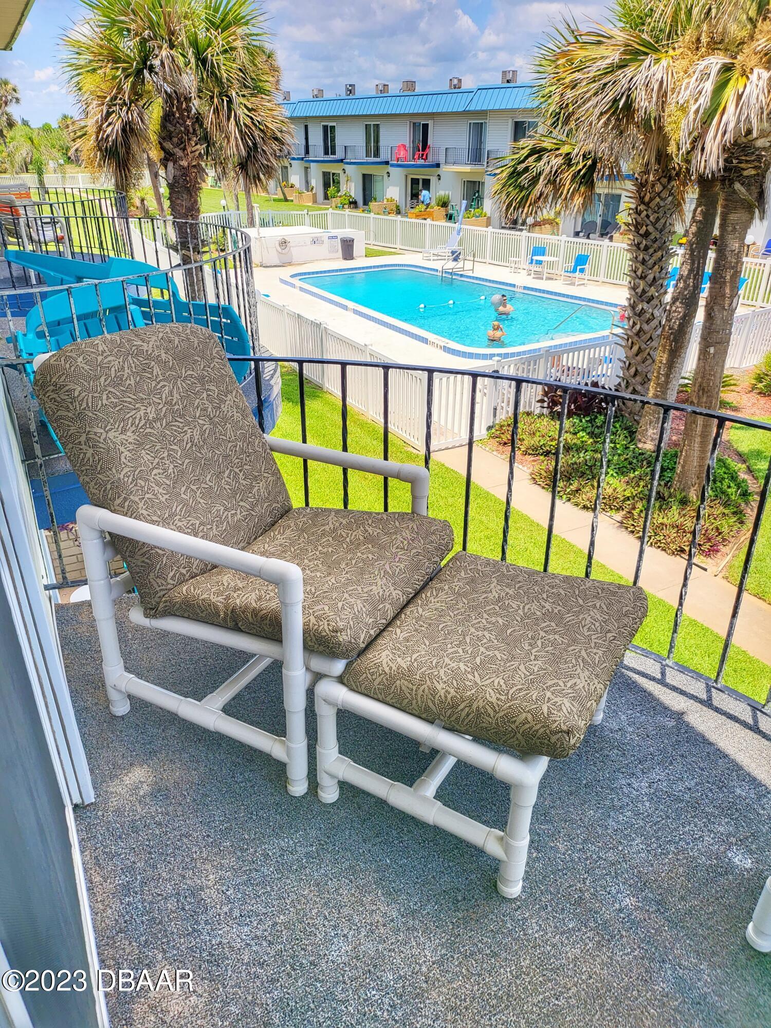 2750 Ocean Shore Boulevard, Unit 8 Ormond Beach, FL 32176 - Photo 19 of 60 a house view with a outdoor space