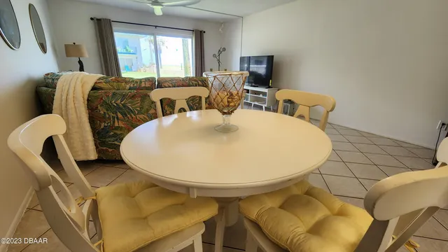 a bedroom with two beds and a large window