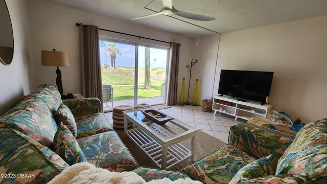 a kitchen with white cabinets and a stove