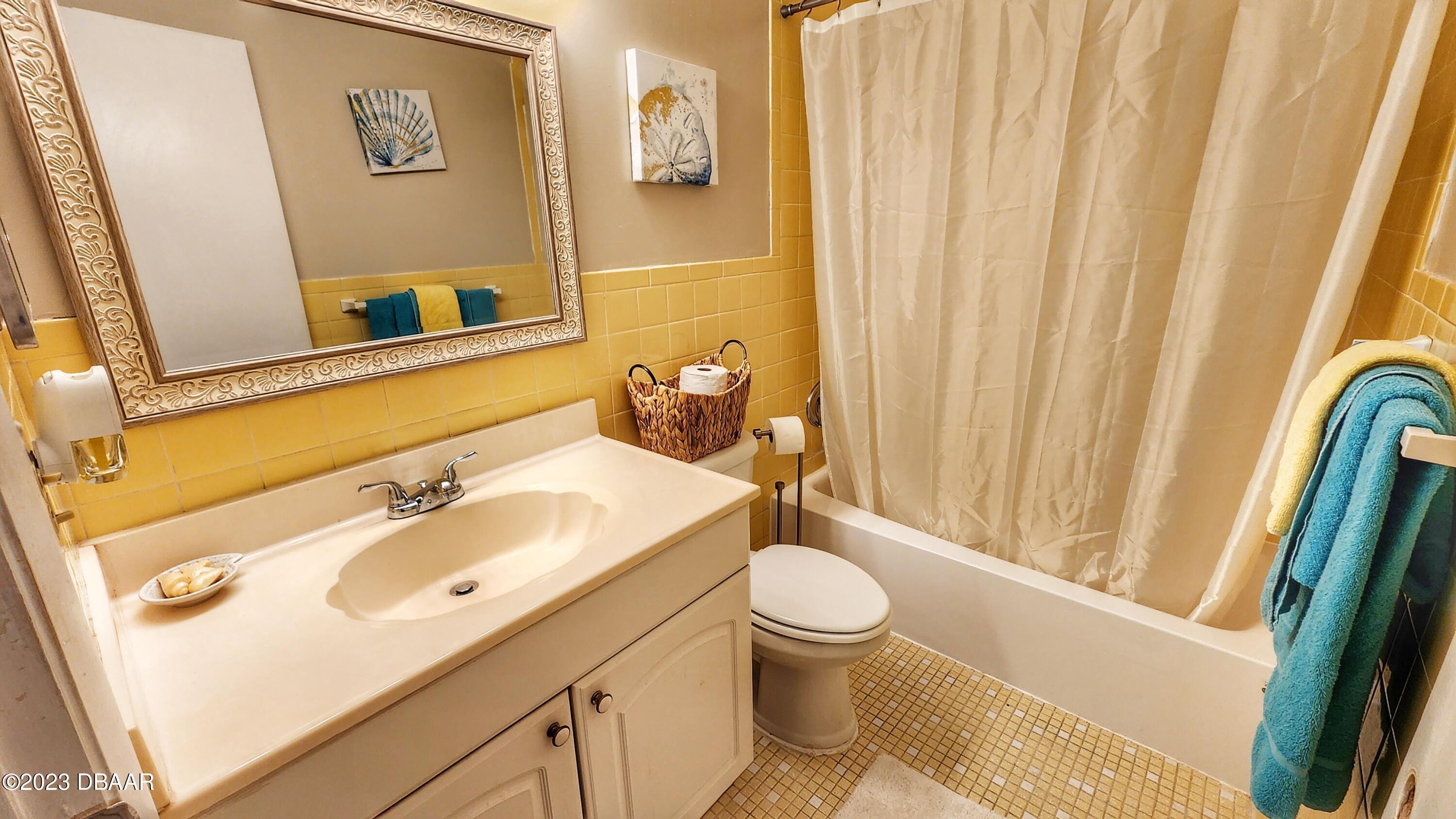 2750 Ocean Shore Boulevard, Unit 8 Ormond Beach, FL 32176 - Photo 50 of 60 a bathroom with a sink toilet and shower