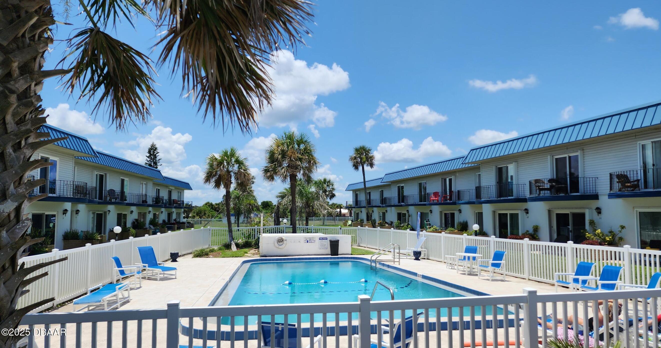 2750 Ocean Shore Boulevard, Unit 8 Ormond Beach, FL 32176 - Photo 5 of 60 a view of a house with a patio