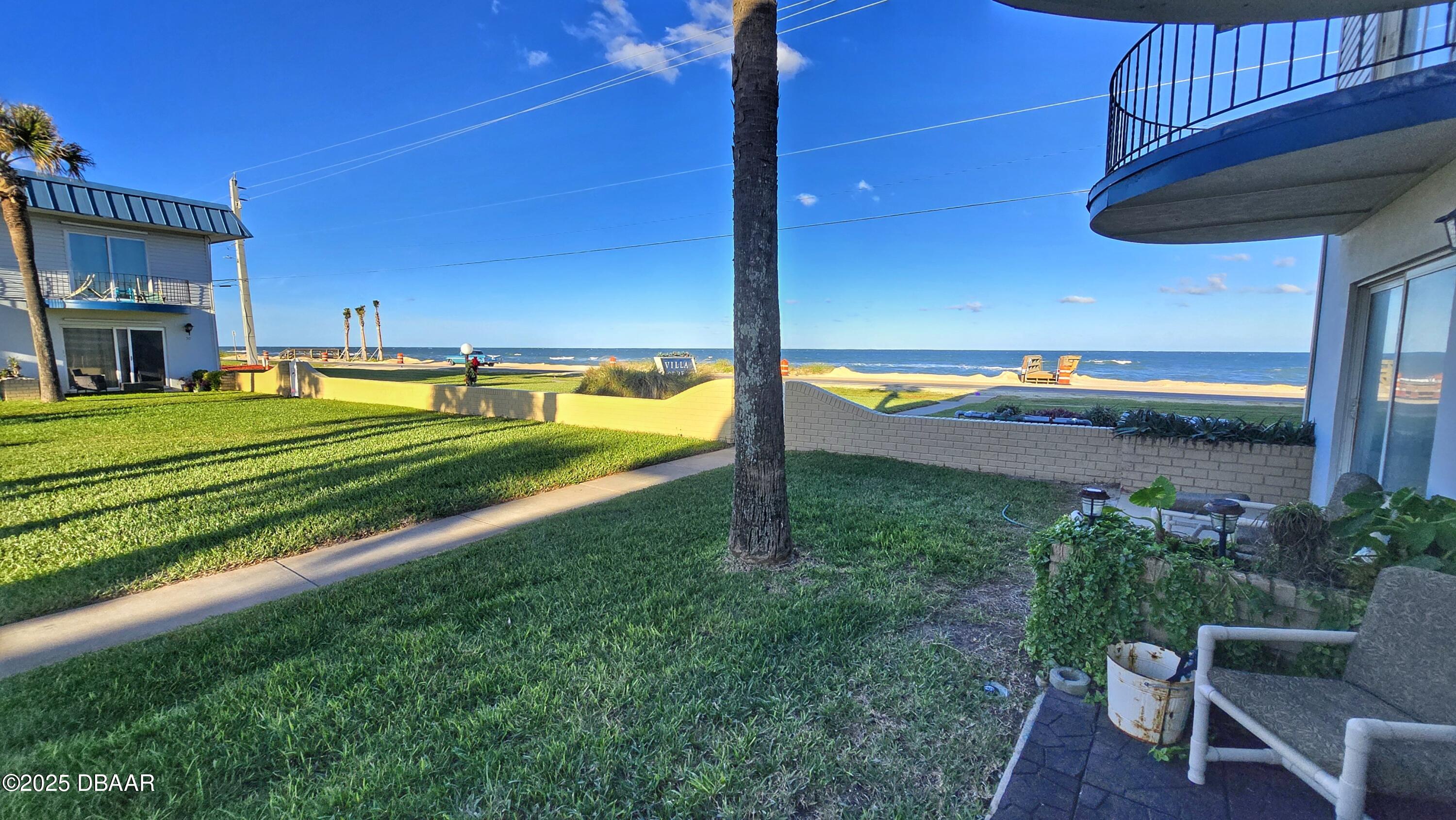 2750 Ocean Shore Boulevard, Unit 8 Ormond Beach, FL 32176 - Photo 56 of 60 a view of a house with a yard