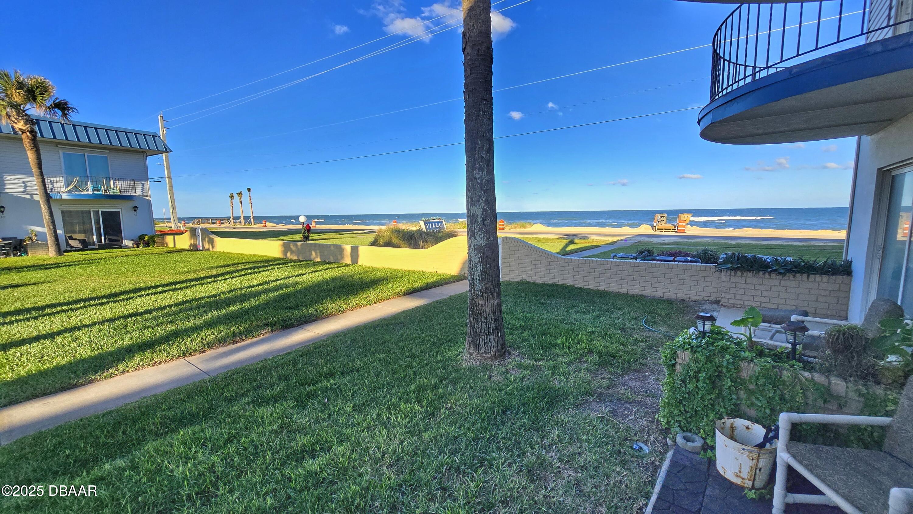 2750 Ocean Shore Boulevard, Unit 8 Ormond Beach, FL 32176 - Photo 57 of 60 a view of a backyard with swimming pool
