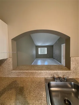 a view of empty room with windows