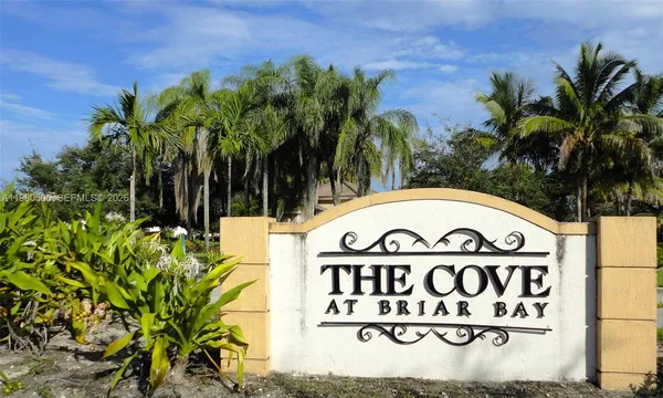 an aerial view of residential houses with outdoor space and street view