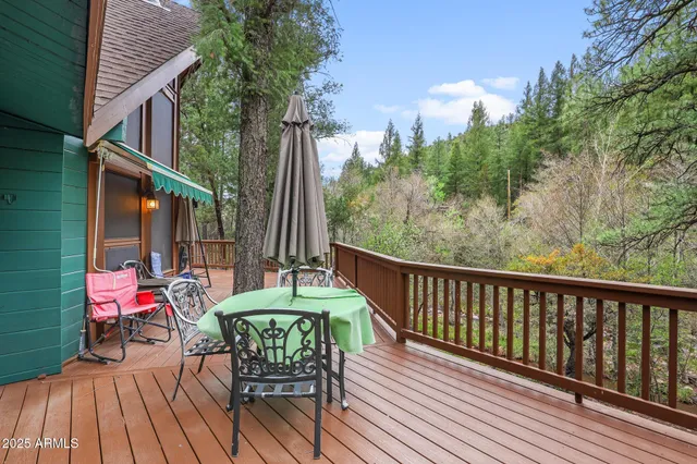 a view of a chair and tables in the balcony