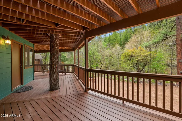 a view of porch with wooden floor
