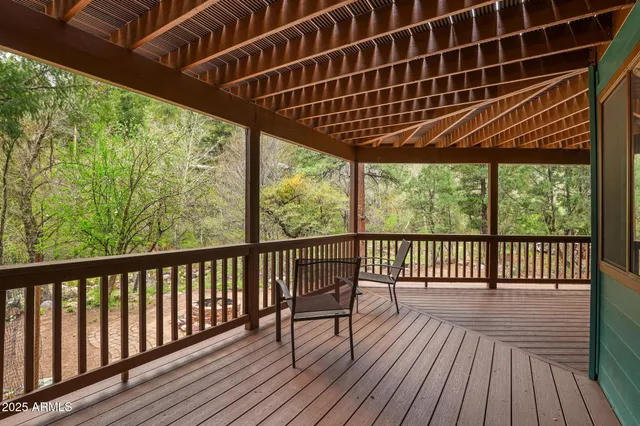 a view of balcony with wooden floor