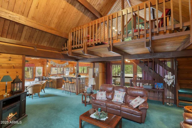 a outdoor living space with patio furniture and a fireplace