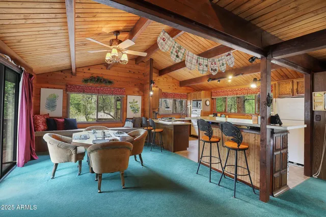 a view of a patio with table and chairs