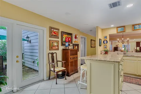 a view of kitchen with furniture and refrigerator