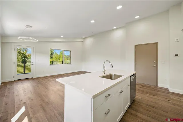a kitchen with sink and microwave