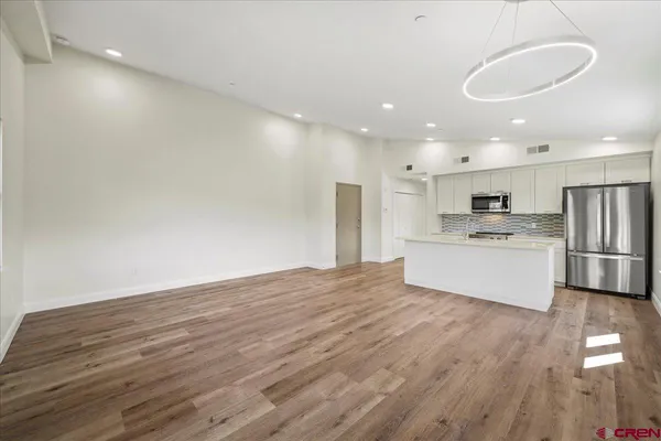 a kitchen with sink and microwave