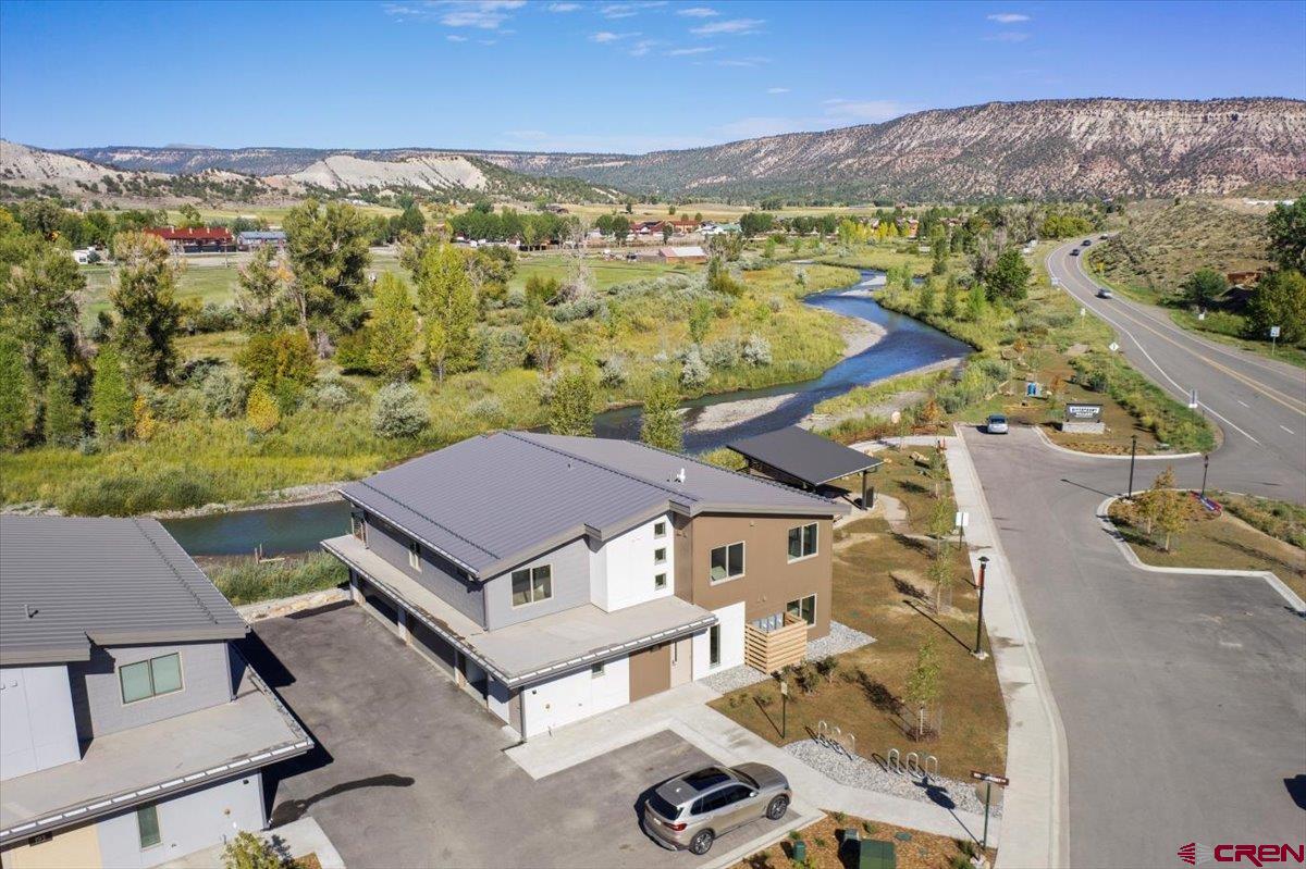 199 Riverfront Lane, Unit 200 Ridgway, CO 81432 - Photo 19 of 28 an aerial view of a house with a mountain