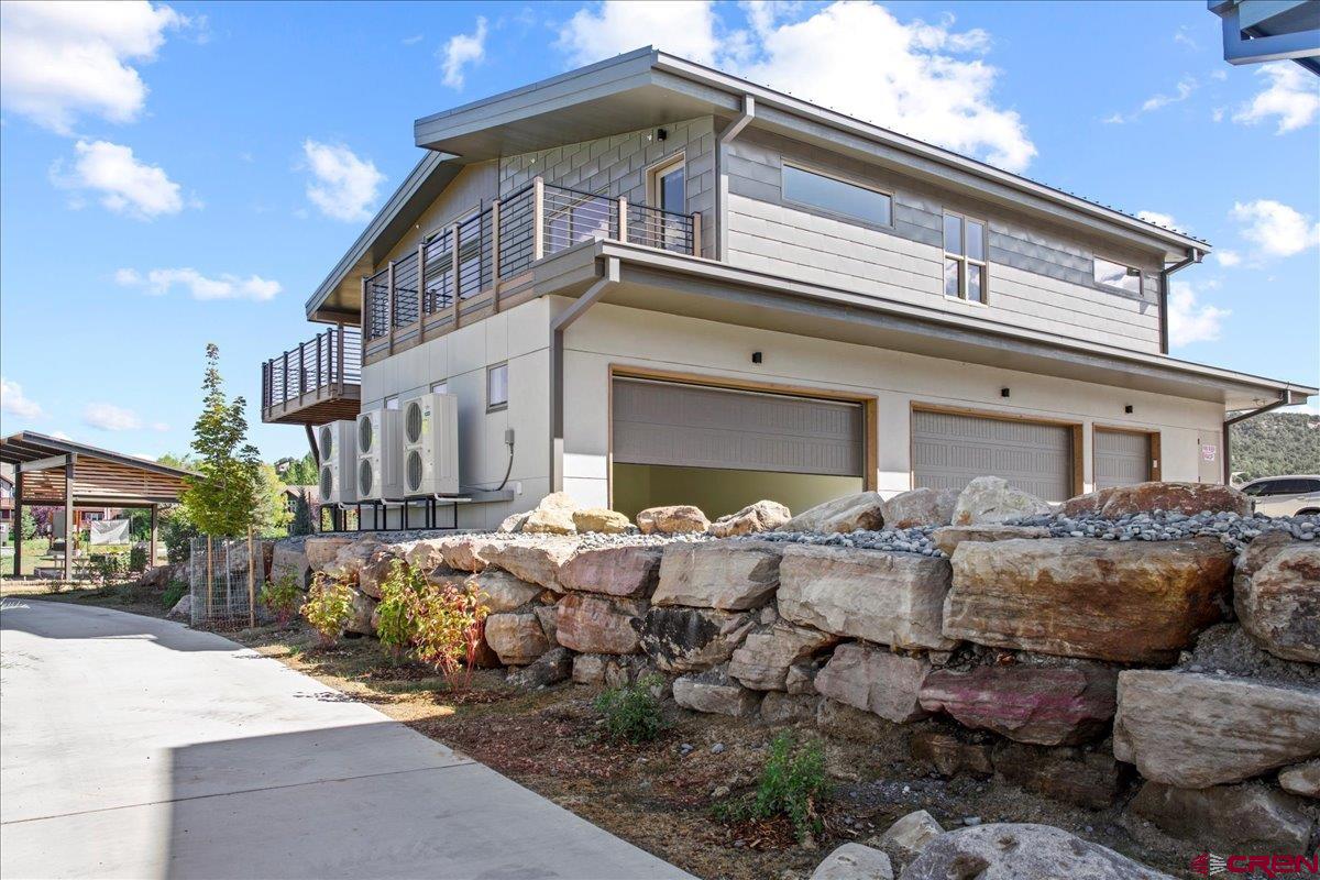 199 Riverfront Lane, Unit 200 Ridgway, CO 81432 - Photo 20 of 28 a front view of house with outdoor seating