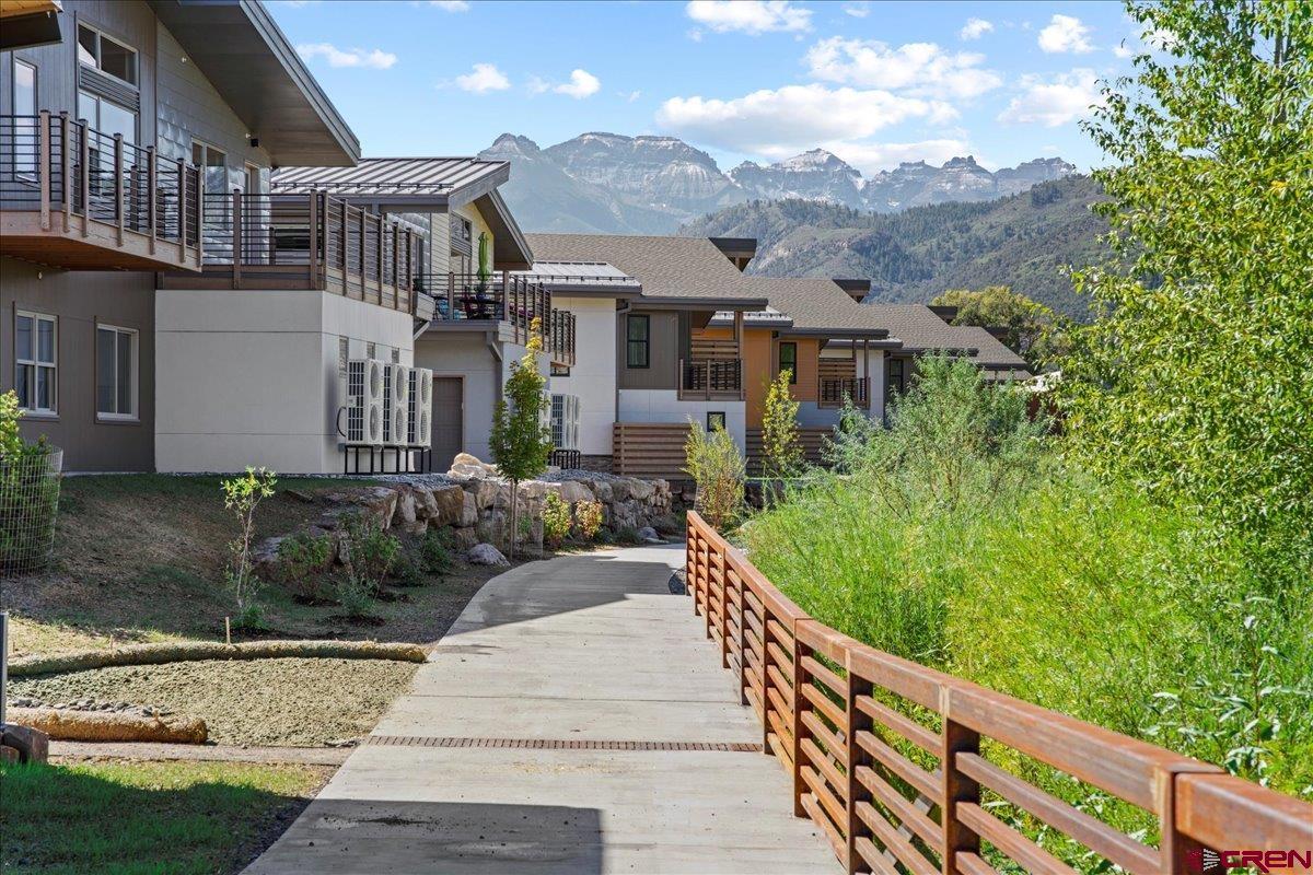 199 Riverfront Lane, Unit 200 Ridgway, CO 81432 - Photo 21 of 28 a front view of a house with a yard