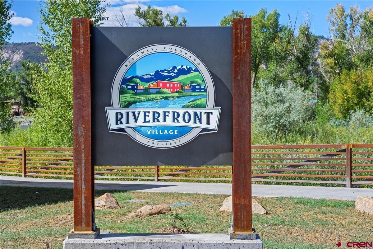 199 Riverfront Lane, Unit 200 Ridgway, CO 81432 - Photo 22 of 28 a sign on the side of a building