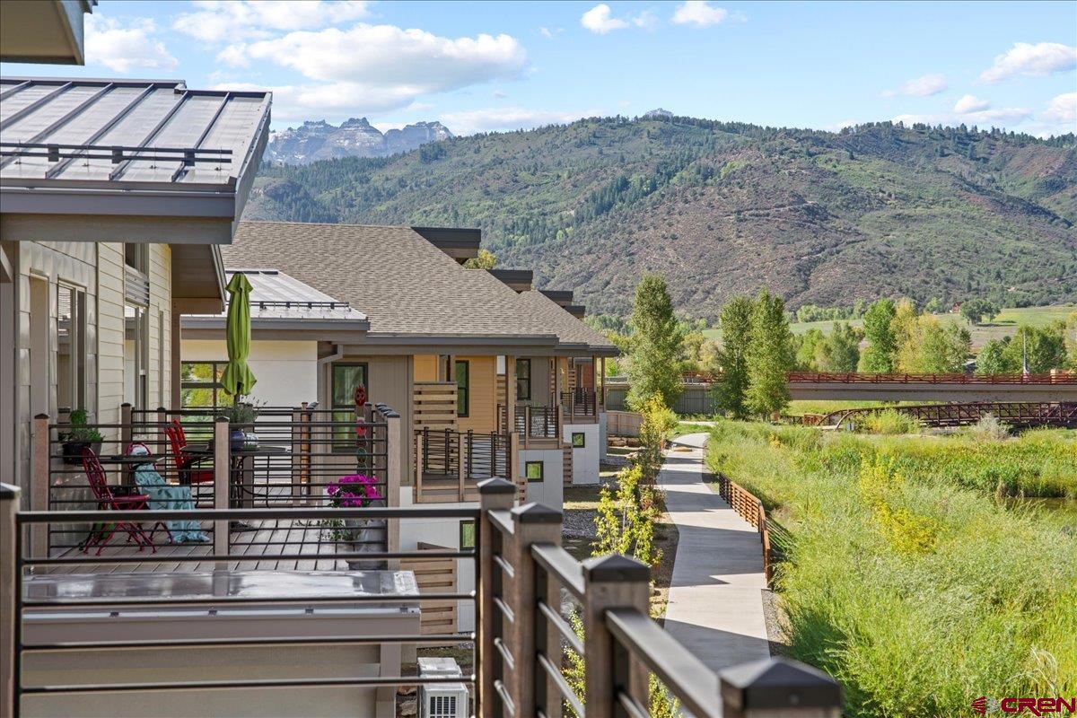 199 Riverfront Lane, Unit 200 Ridgway, CO 81432 - Photo 27 of 28 a front view of a house with a yard