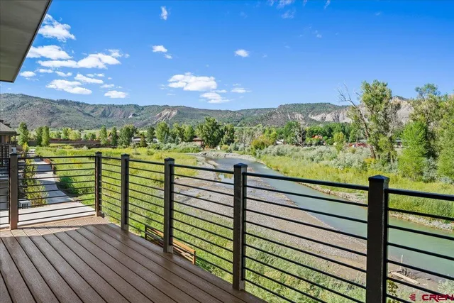 a view of a balcony with an outdoor seating