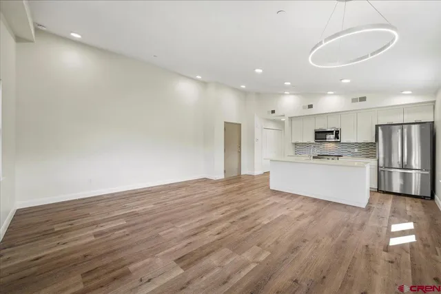a view of kitchen with wooden floor