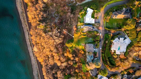 an aerial view of houses with city view
