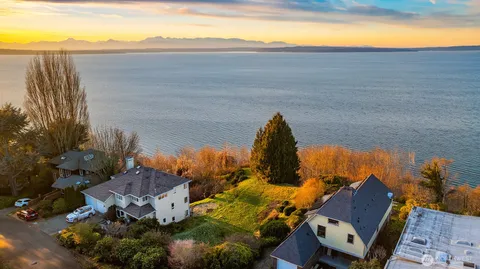 a view of a field with an ocean view