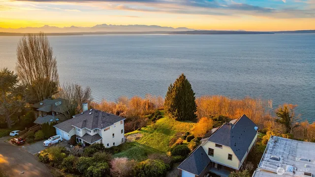 a view of a field with an ocean view
