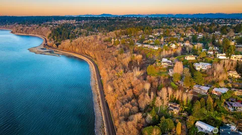 an aerial view of a house with a lake view