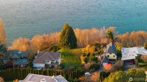 an aerial view of a house with a lake view