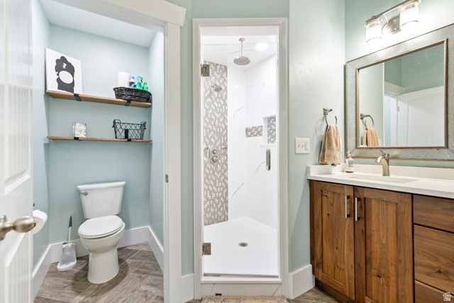 580 Cherry Ridge Lane Richmond, UT 84333 - Photo 20 of 53 Master bathroom with a shower stall, vanity, and parquet floors