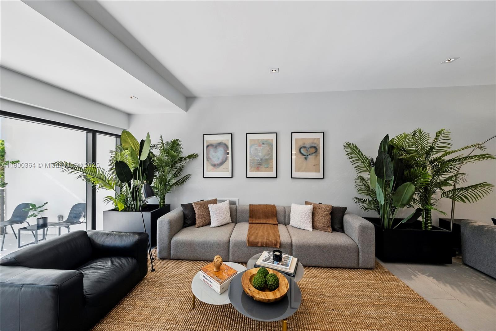 4275 Prairie Avenue Miami Beach, FL 33140 - Photo 15 of 61 a living room with furniture and a potted plant