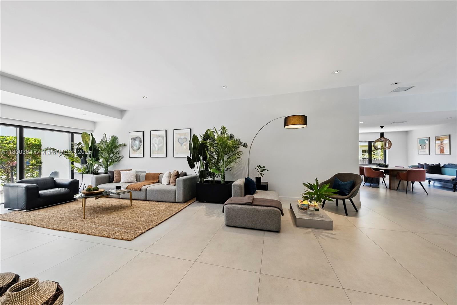 4275 Prairie Avenue Miami Beach, FL 33140 - Photo 18 of 61 a living room with furniture potted plant and a large window