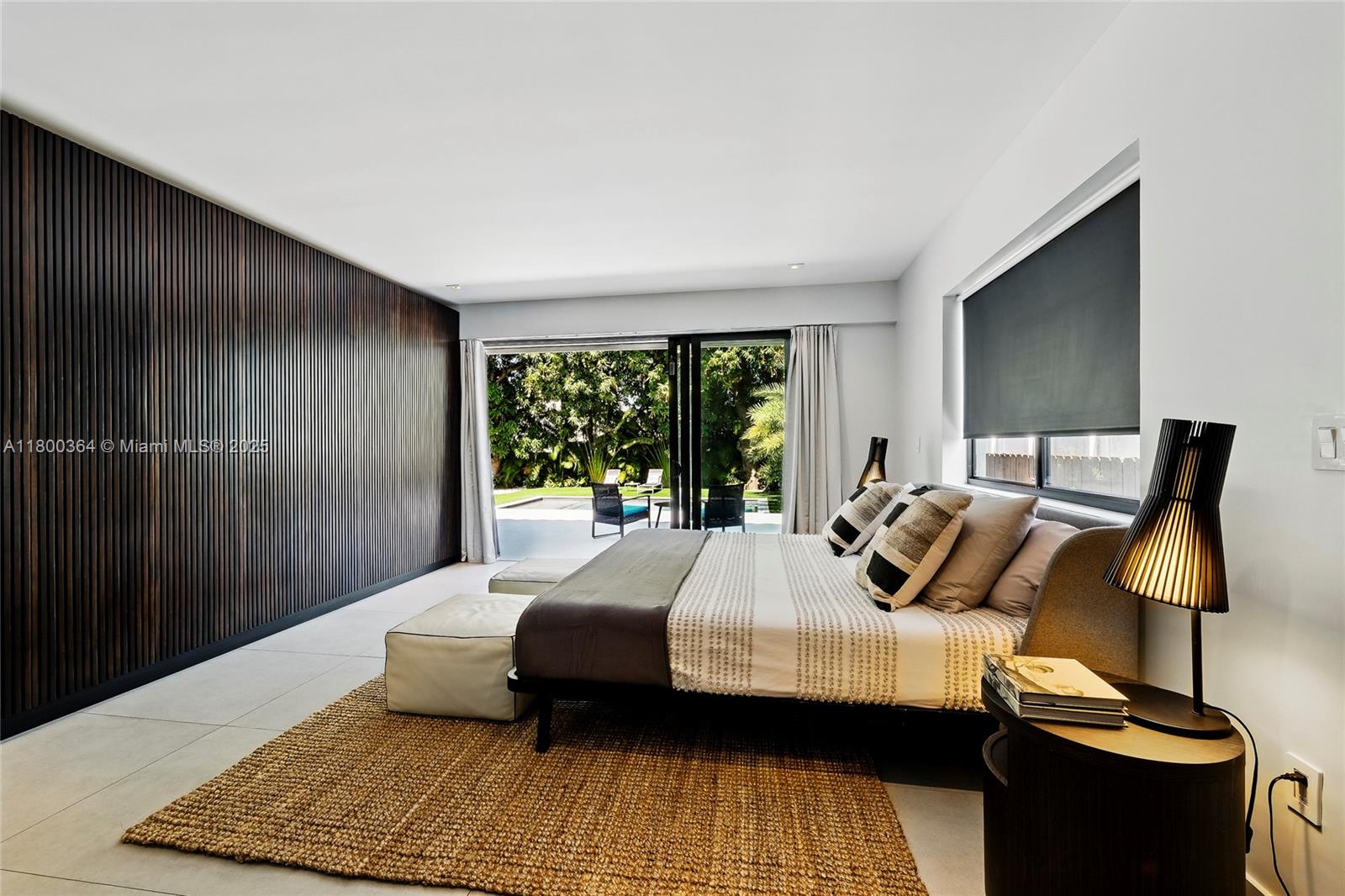 4275 Prairie Avenue Miami Beach, FL 33140 - Photo 31 of 61 a bedroom with a bed and wooden floor
