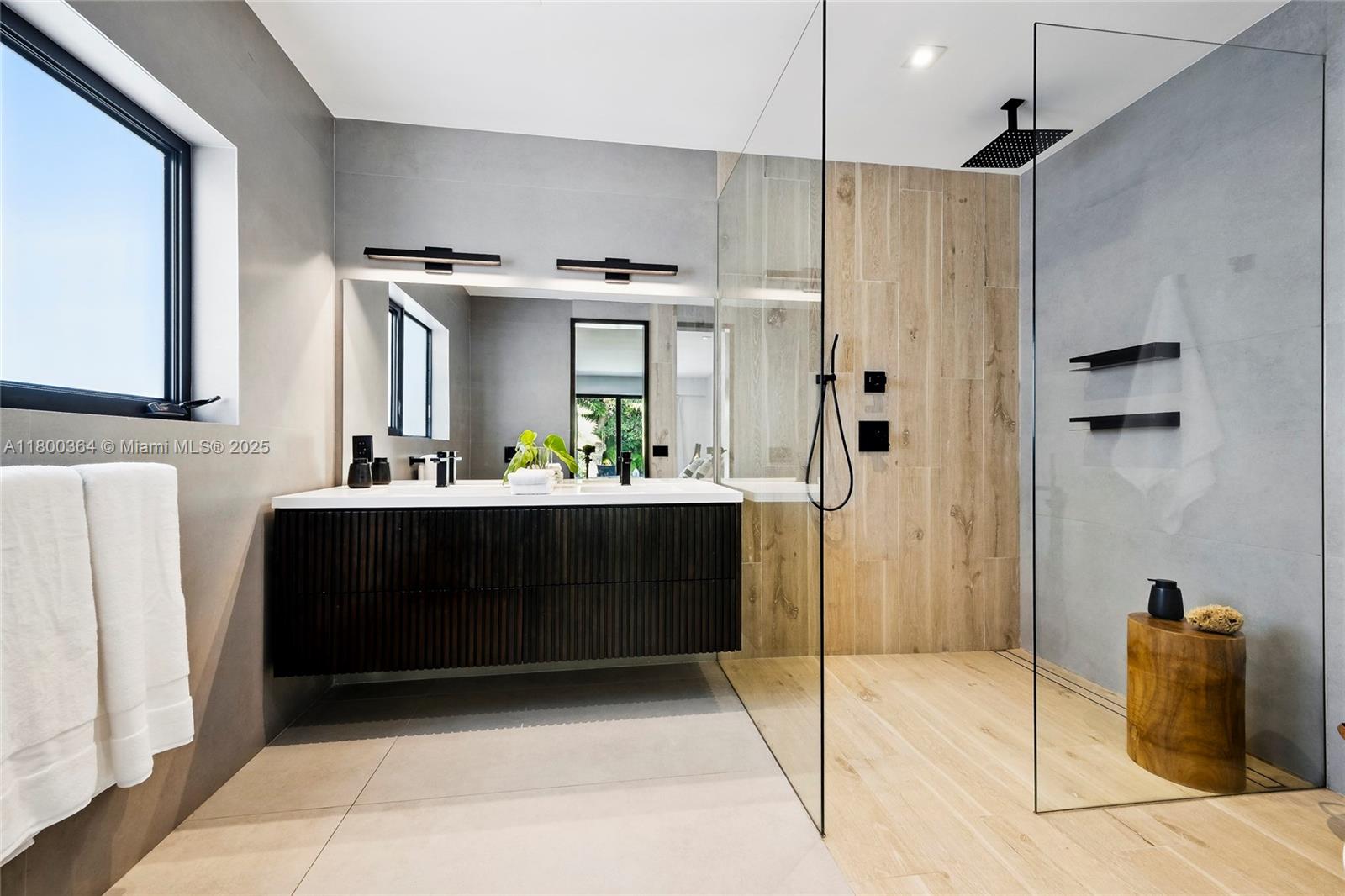 4275 Prairie Avenue Miami Beach, FL 33140 - Photo 35 of 61 a bathroom with a sink and a mirror