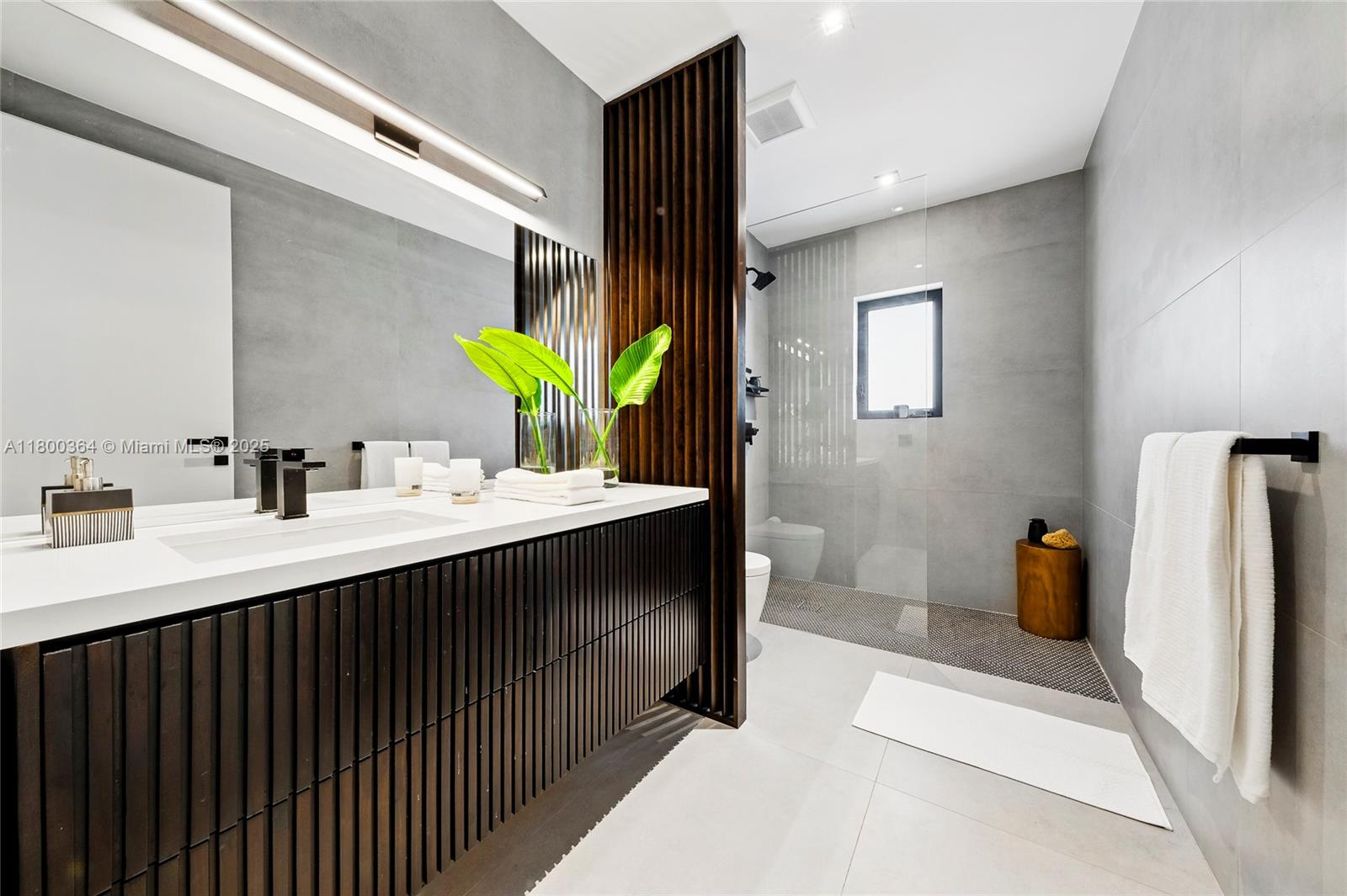 4275 Prairie Avenue Miami Beach, FL 33140 - Photo 45 of 61 a bathroom with a sink double vanity and a mirror