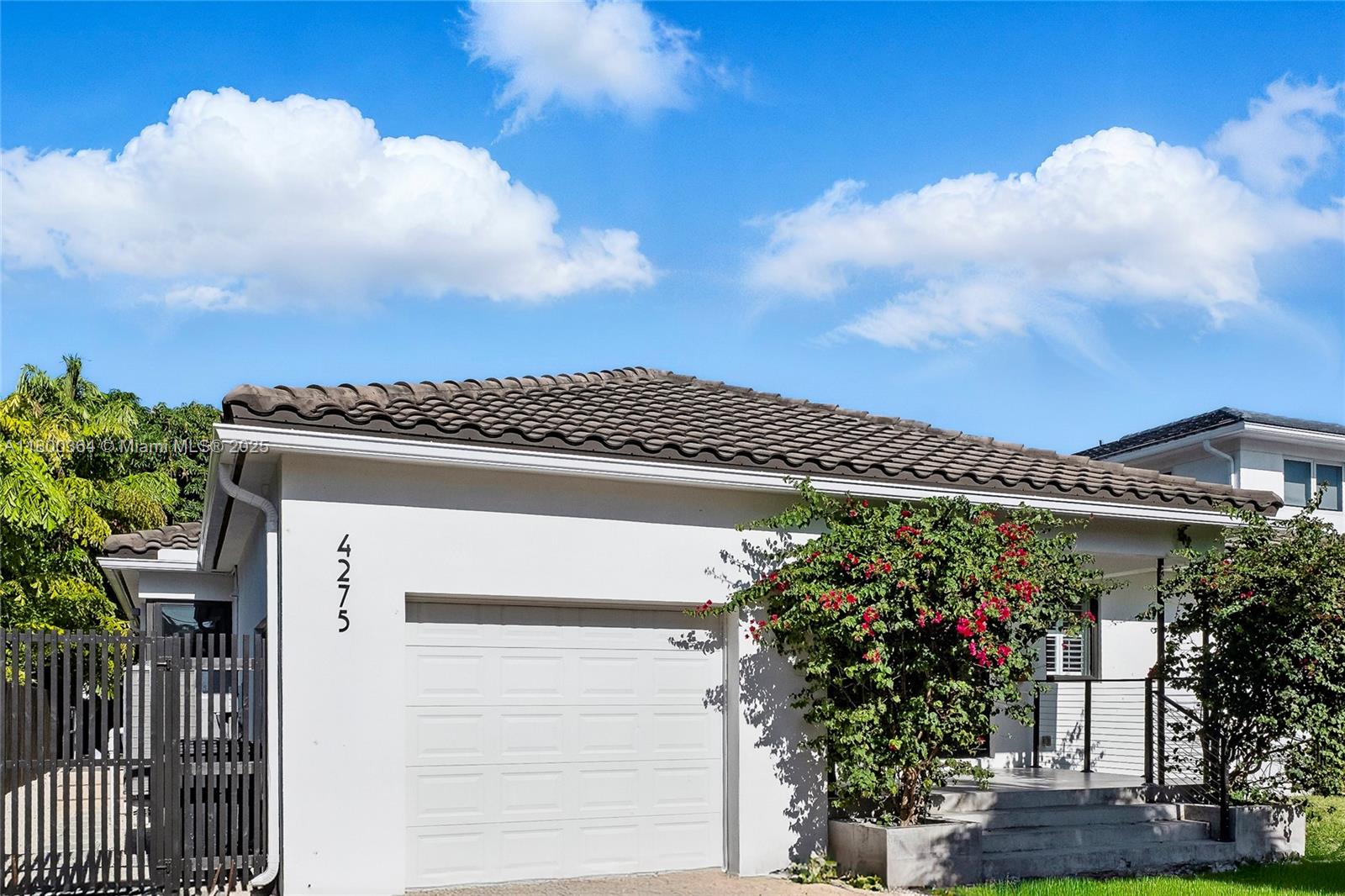 4275 Prairie Avenue Miami Beach, FL 33140 - Photo 56 of 61 a view of a house with a flower garden