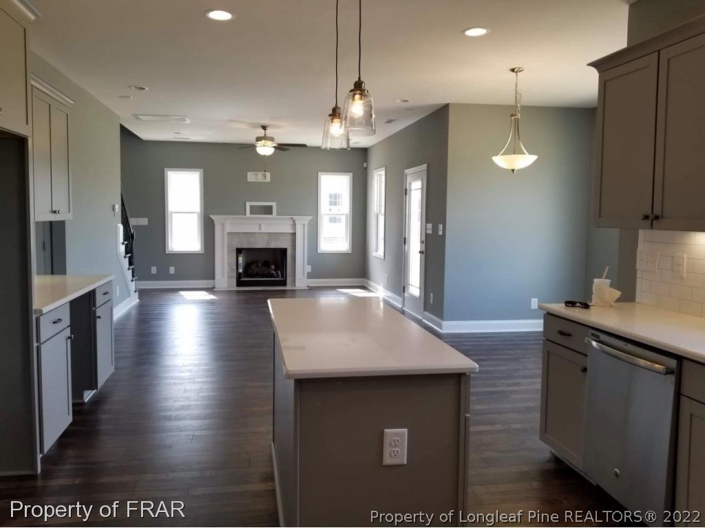 3627 Thrower Road Hope Mills, NC 28348 - Photo 16 of 35 a kitchen with kitchen island a sink stainless steel appliances and cabinets