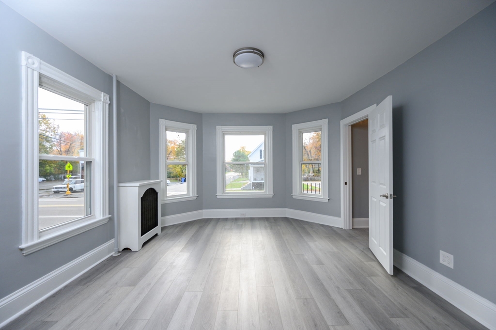 485 Temple Street Whitman, MA 02382 - Photo 11 of 34 a view of livingroom with window and hardwood floor