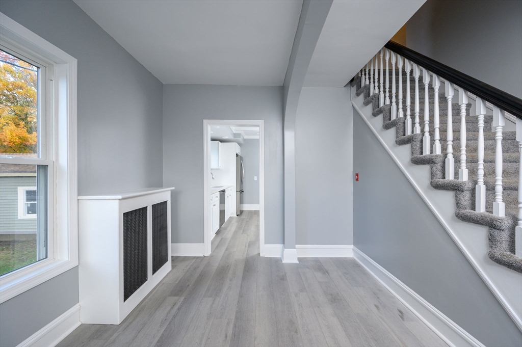 485 Temple Street Whitman, MA 02382 - Photo 18 of 34 a view of a hallway with wooden floor and staircase